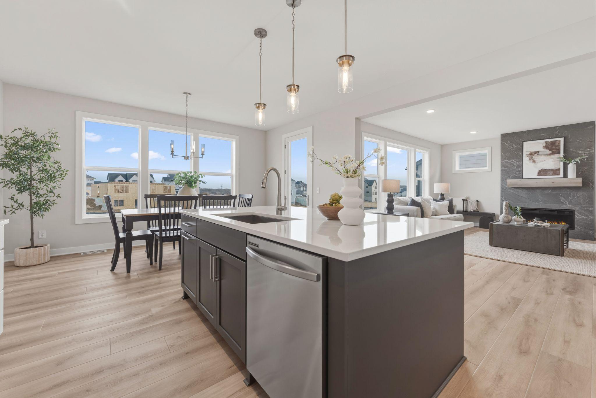 Gourmet kitchen with wall oven and microwave, gas range and built-in hood vent with upgraded stainless steel appliances