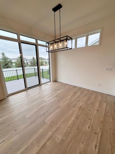Contemporary dining area lighting and view of the deck