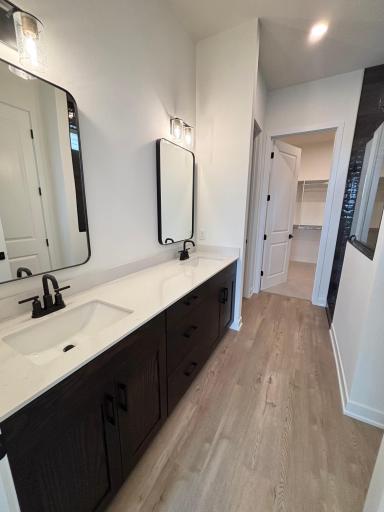 Main bedroom attached bathroom and entry to large walk-in closet
