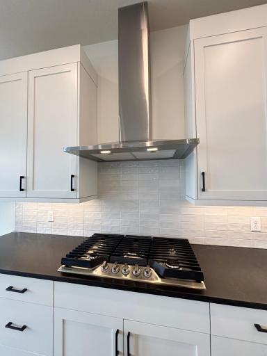 Gourmet kitchen with SS hood and gas cook top