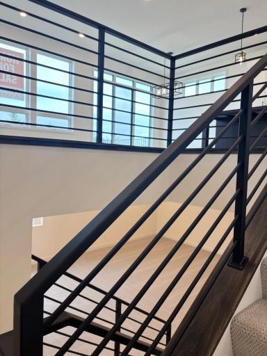 The metal railing adds even more drama to this stunning home