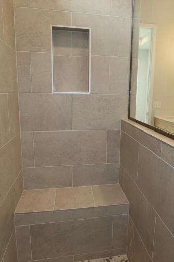 Primary Bath Tile Shower with Bench and Recessed Niche
