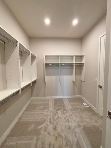 Huge walk-in main bedroom closet walks through to laundry room