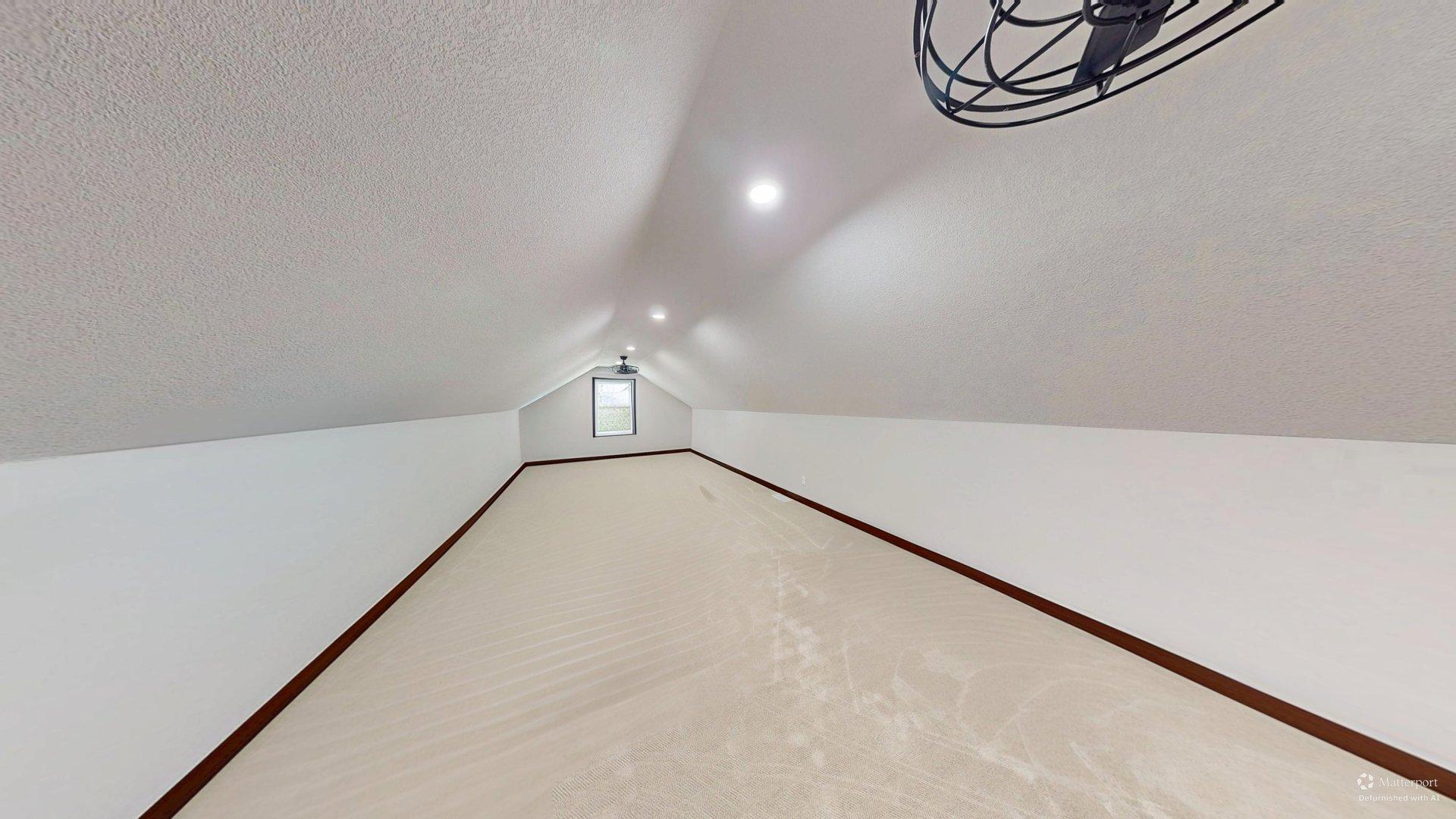Bonus Room Defurnished. Plenty of room for family room, game area, more sleeping space. Could be turned into legal bedroom with addition of a closet.