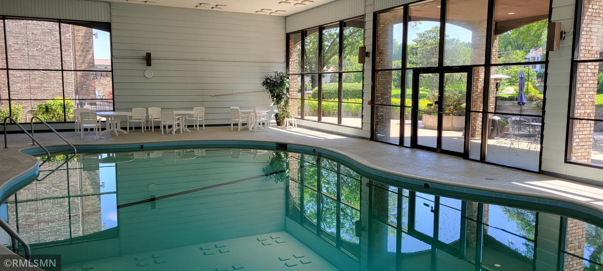 Heated Pool with Glass Walls viewing Patio and Landscap. .jpg