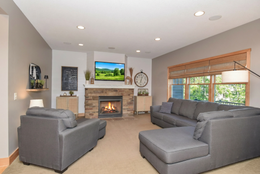 Main level living room with gas fireplace and speaker system