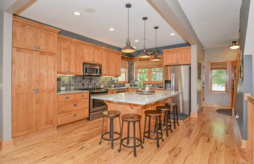 Spacious work area with extra pantry storage and gas range
