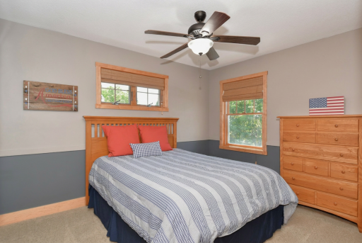 Upper level bedroom #4 with closet organizers and ceiling fan
