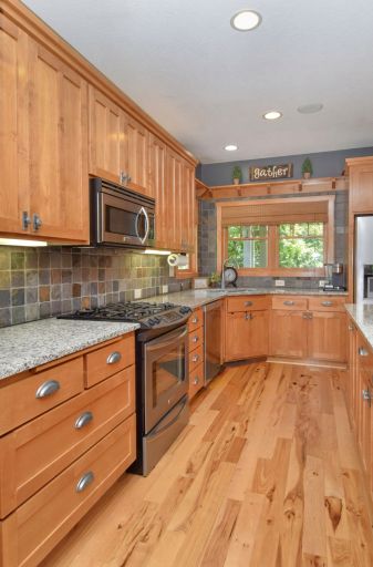 Abundant custom Alder cabinets in kitchen