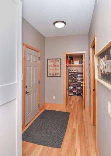 Walk-in closet off garage entrance to home