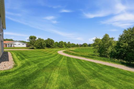 Nearby walking trail lines your backyard.