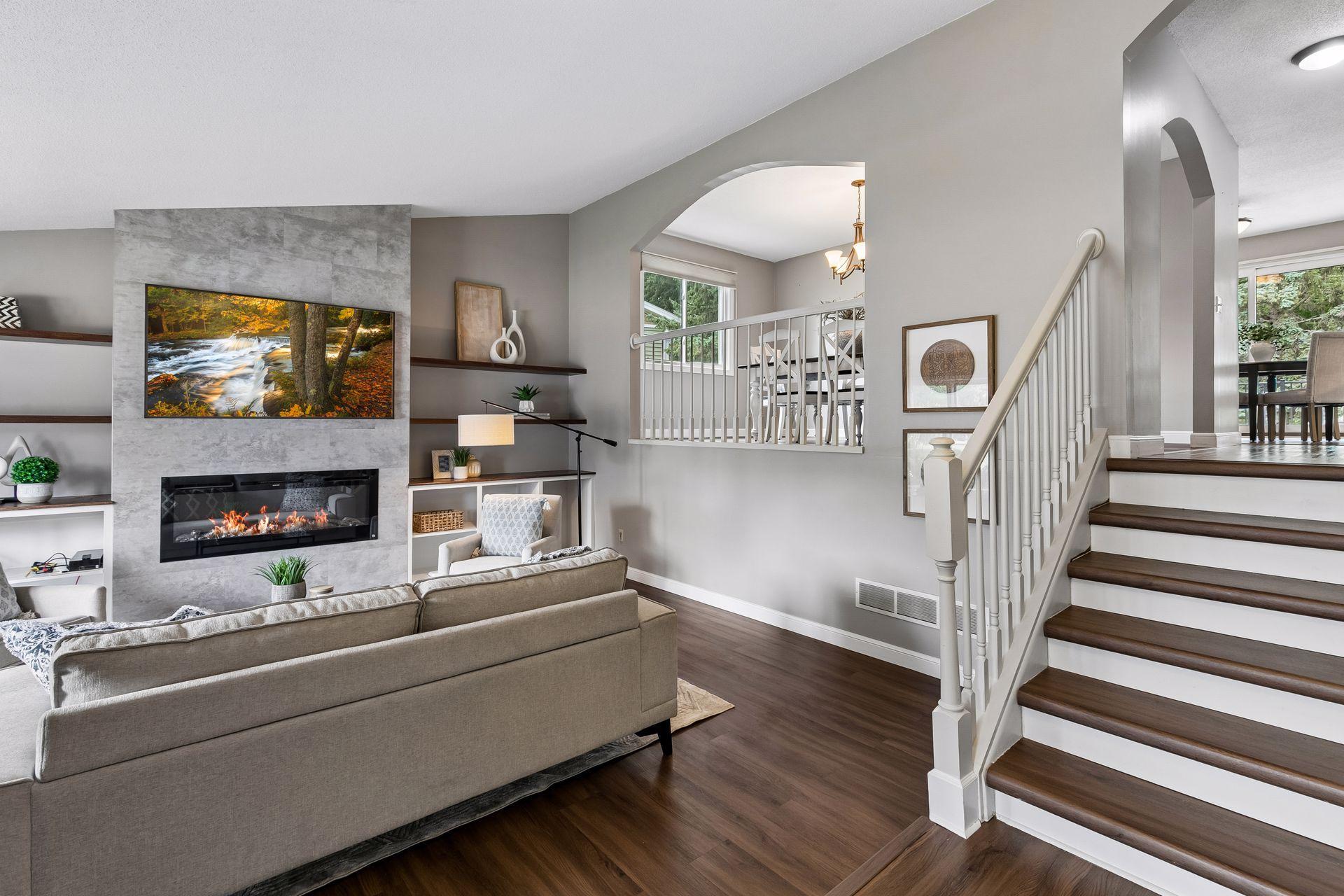 Vaulted Living Room with built-in entertainment center and luxury vinyl flooring.