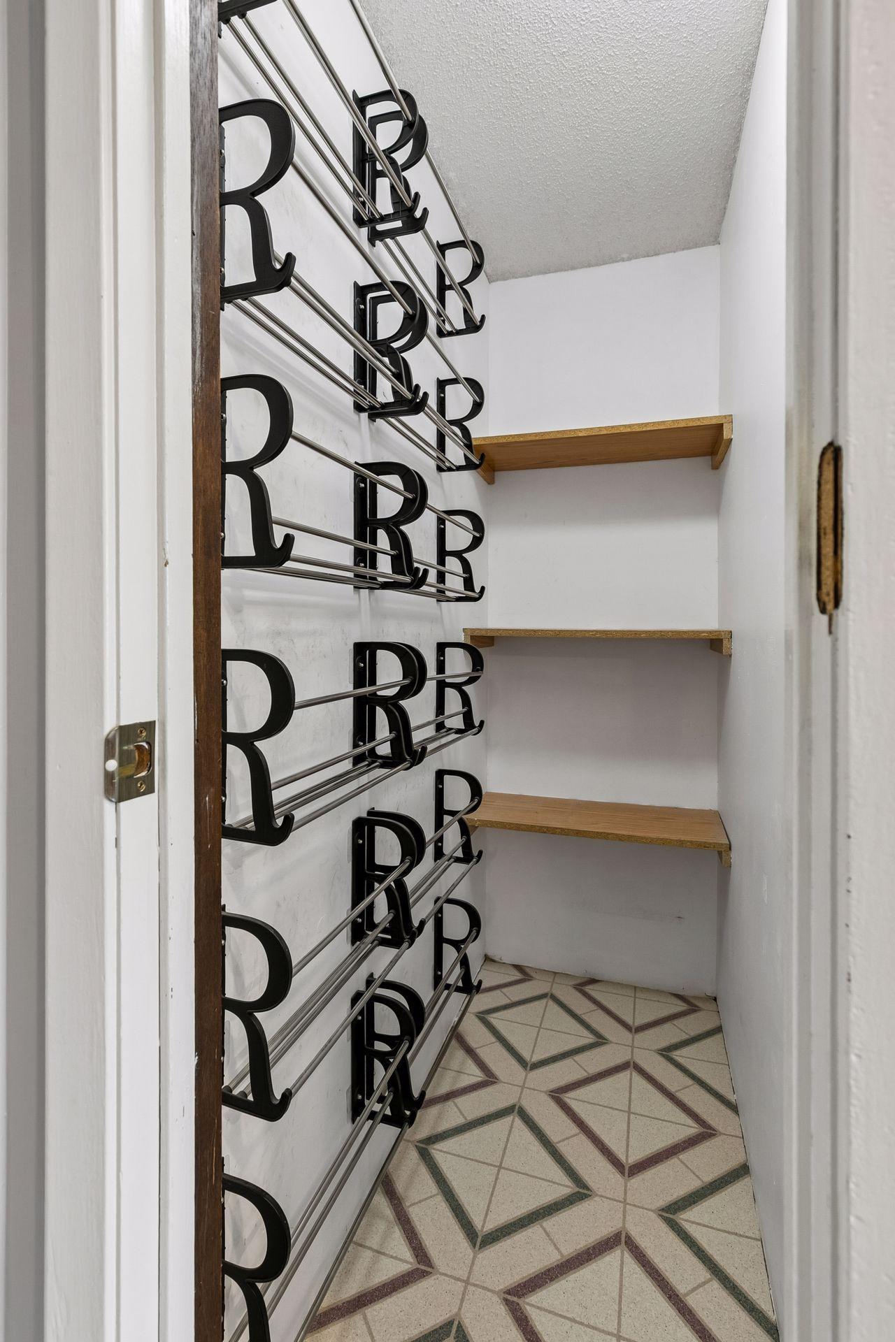 Shoe/coat storage at entrance from Garage
