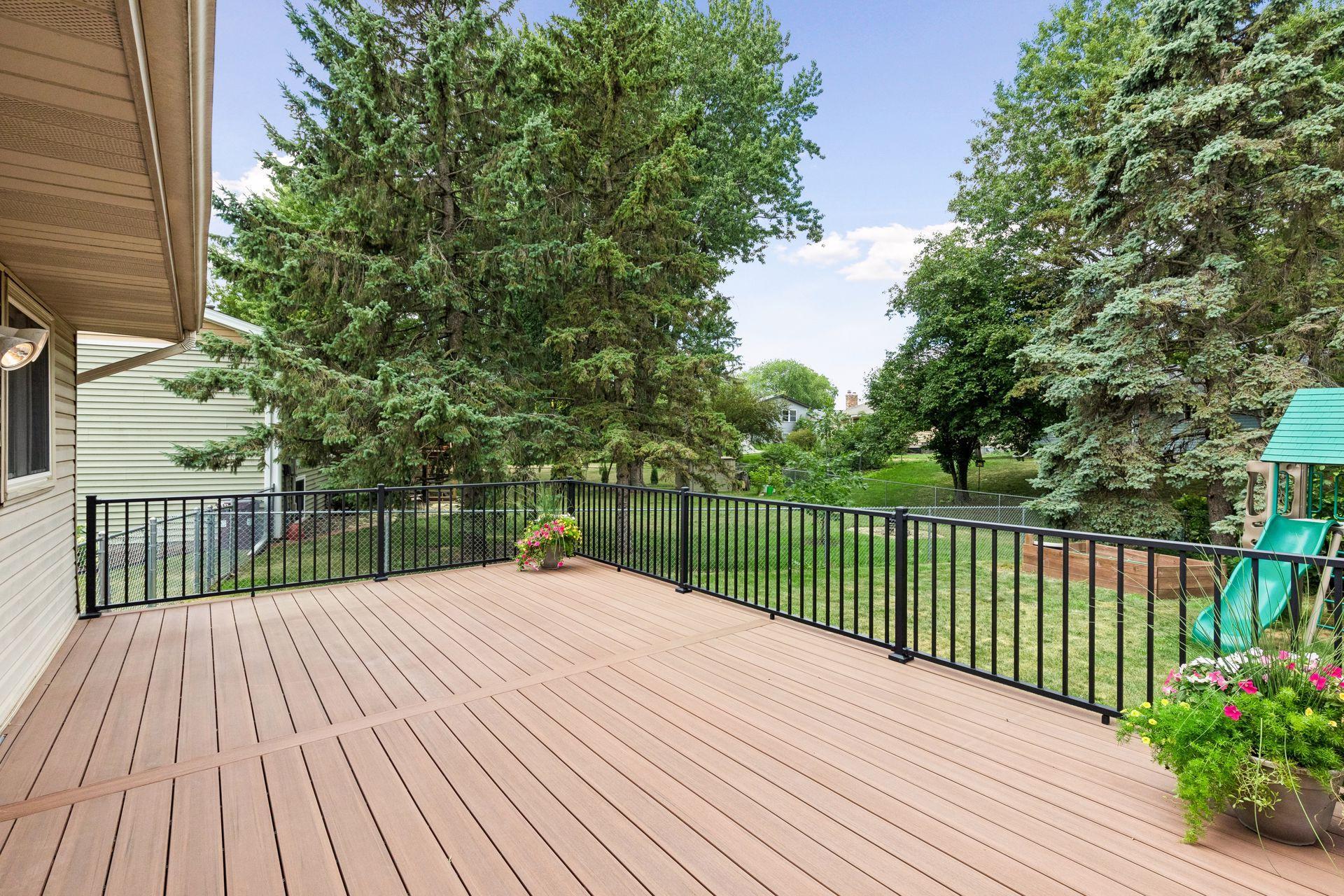 Large deck/patio off Kitchen offers room for dining, grilling and relaxation - great for entertaining!