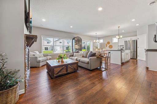Bright Living Room with custom installed wood slat blinds.