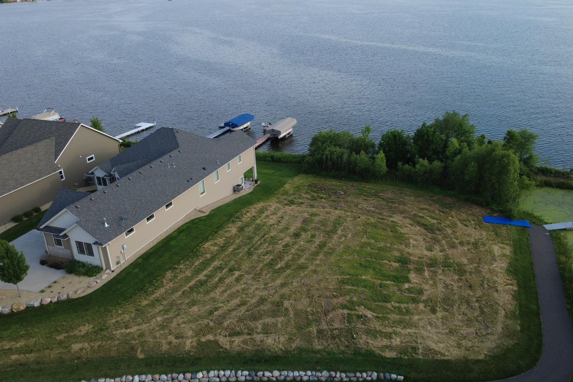 Lot is ready for a walkout build and can accommodate an inground pool.