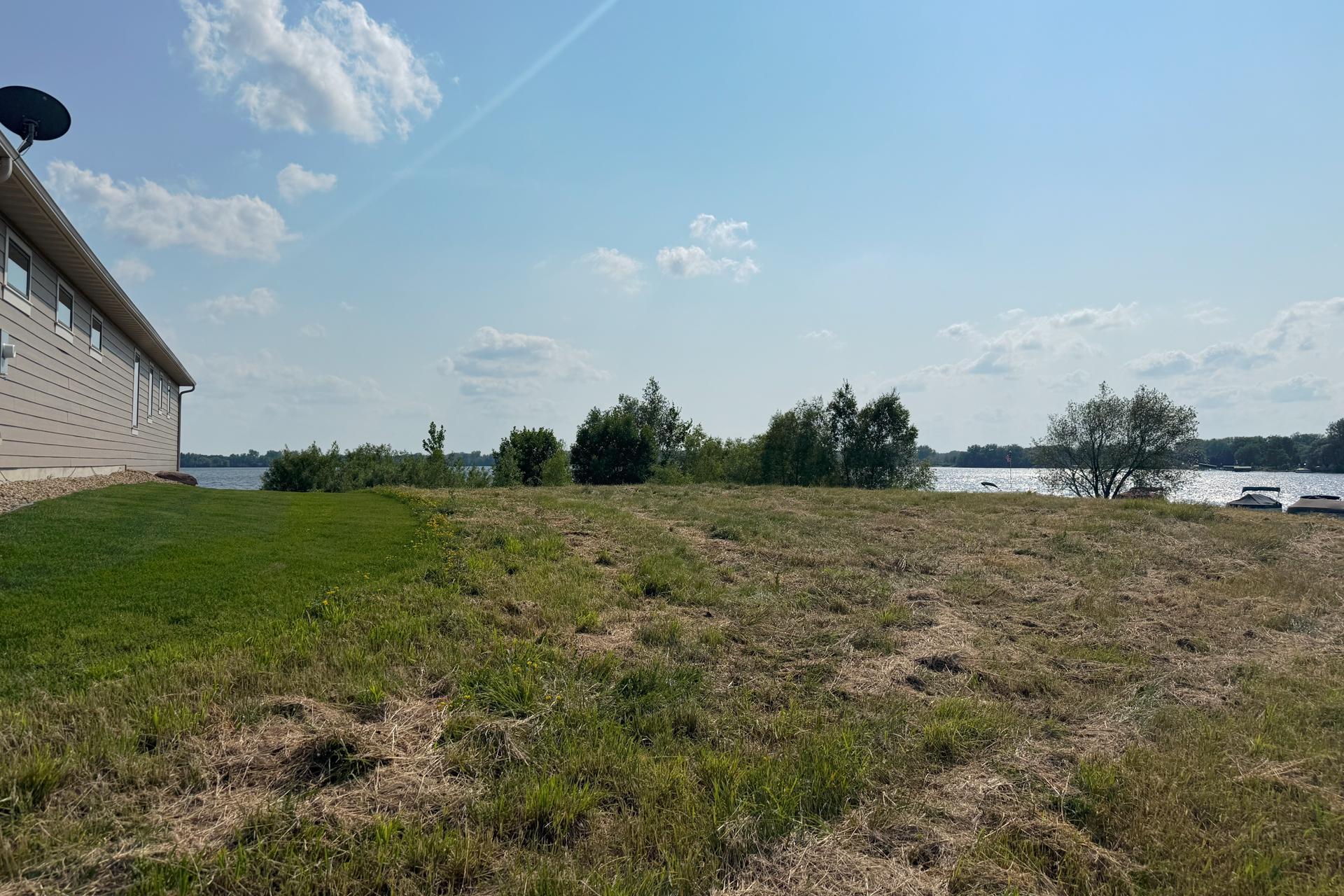 Ground-level view of the lot toward Centerville Lake.