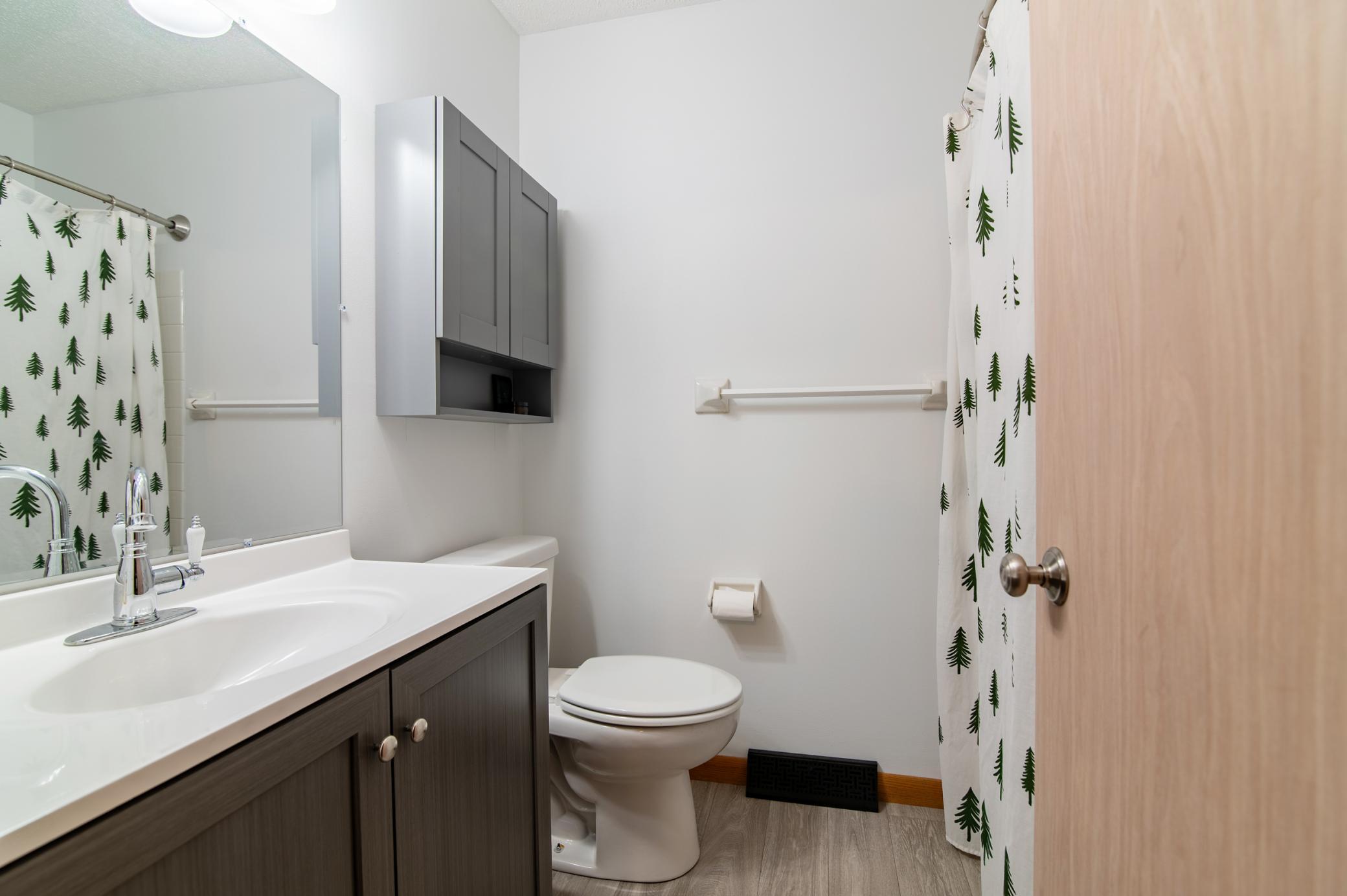 The main level full-bath has plenty of cosmetic updates.