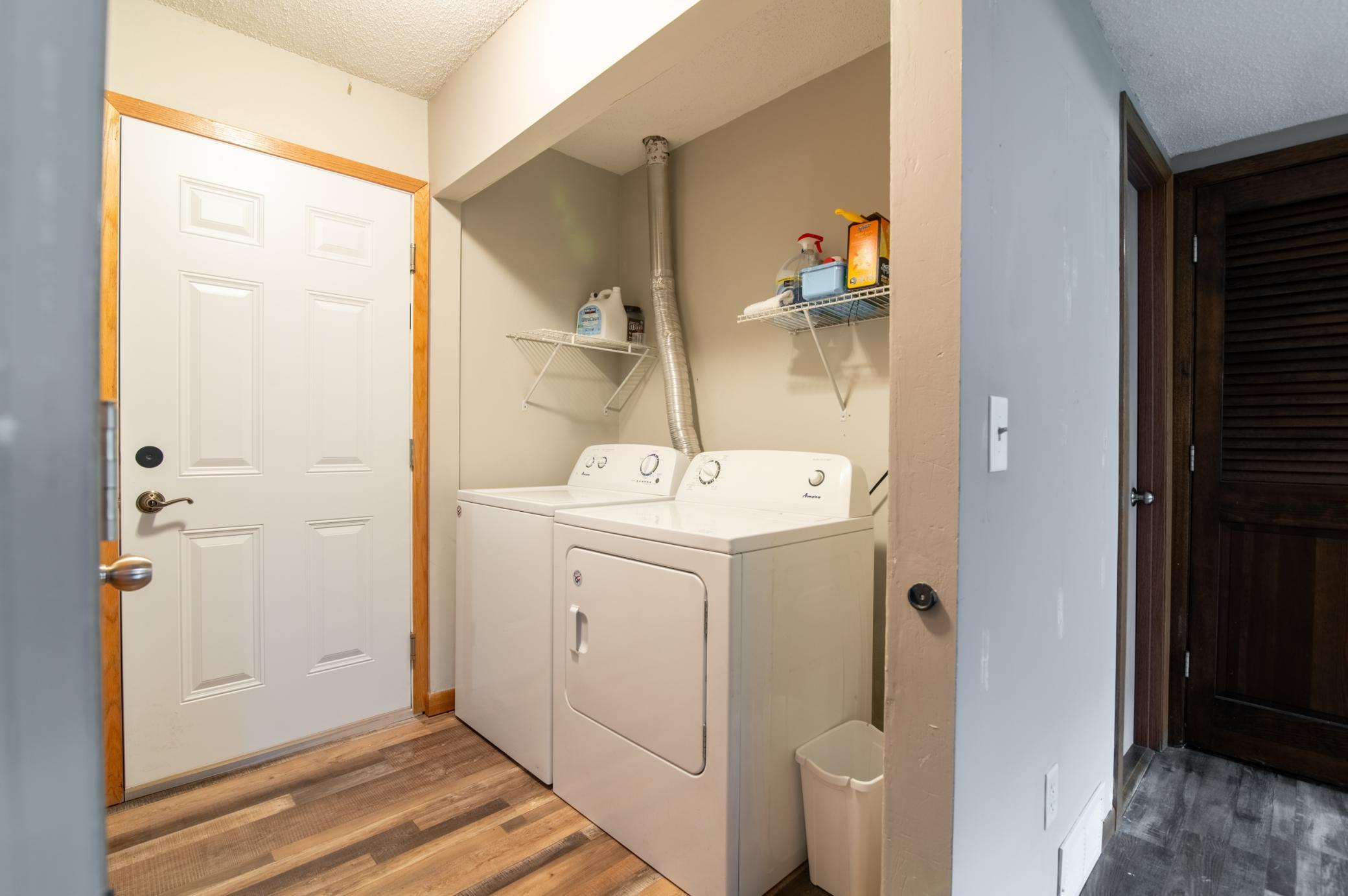 Located just off the garage and at the bottom of the lower level stairs, the laundry closet is conveniently located for tossing dirty clothes as you enter the house. Dirty day at work? The lower level BR is just at the right edge of the photo.