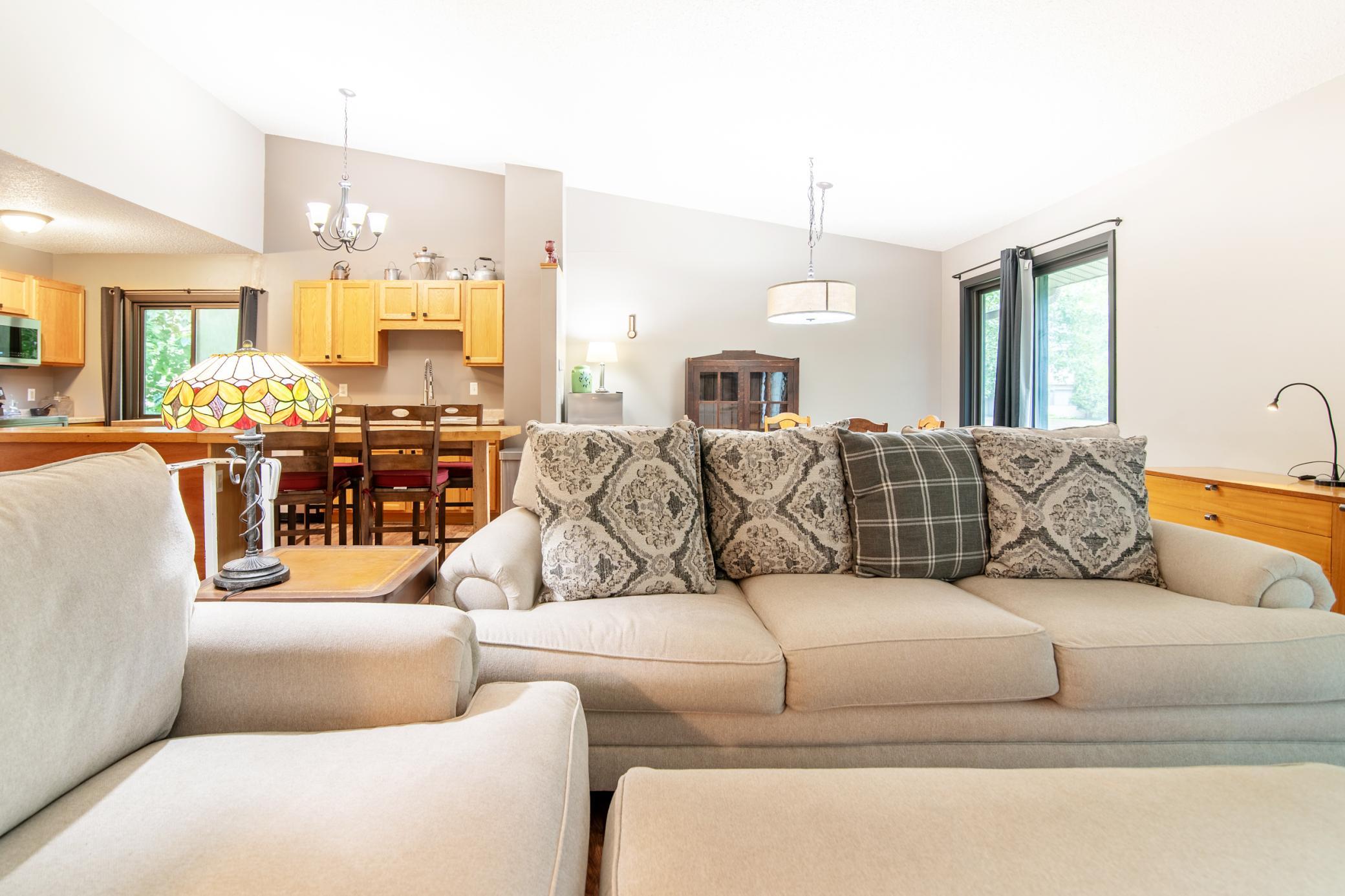 Space abounds in the main level living area with it's open floor plan and vaulted ceilings.