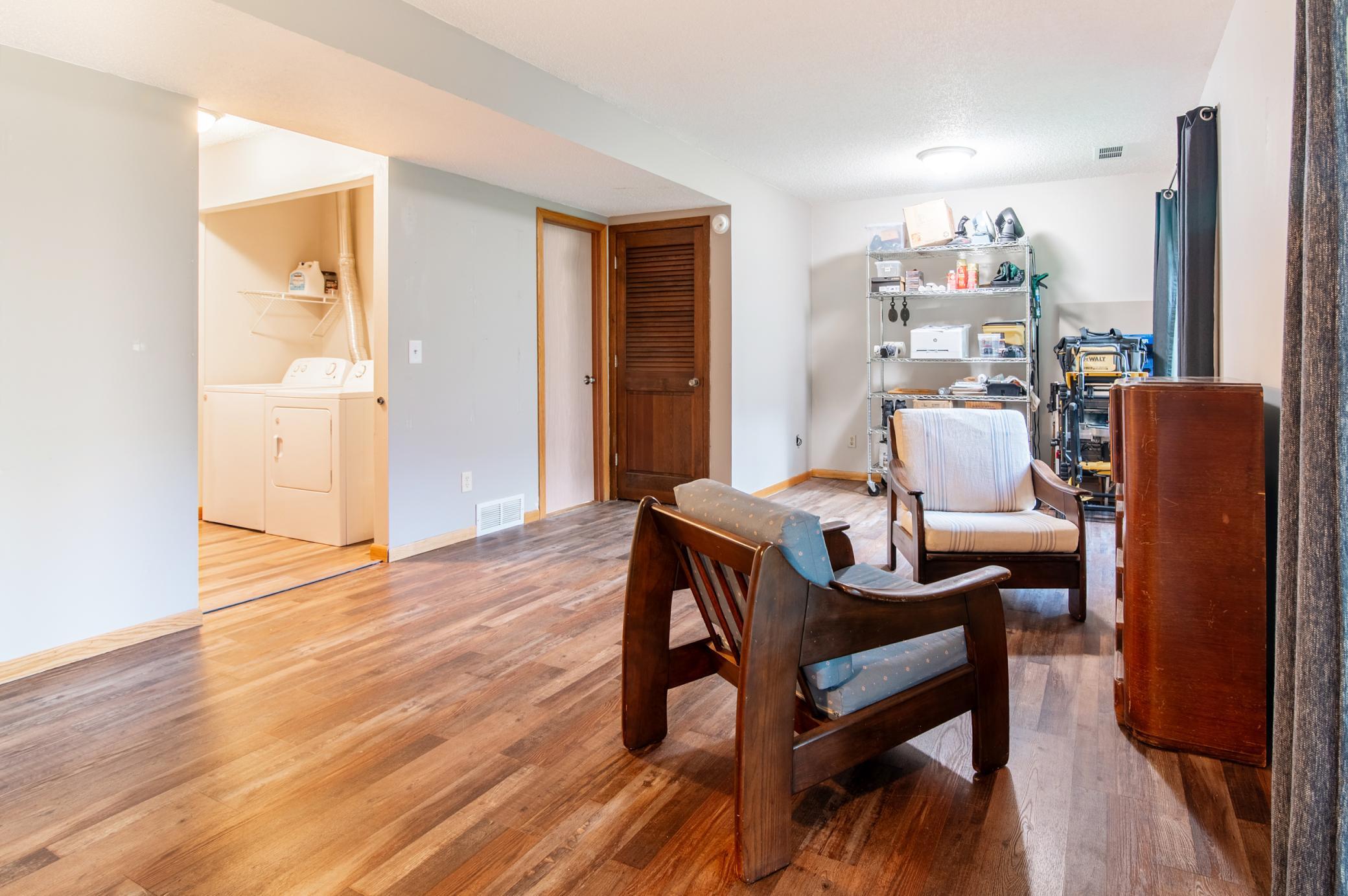 The downstairs family room has plenty of space making it ideal for many uses from a home-office space, play area, family room and more.