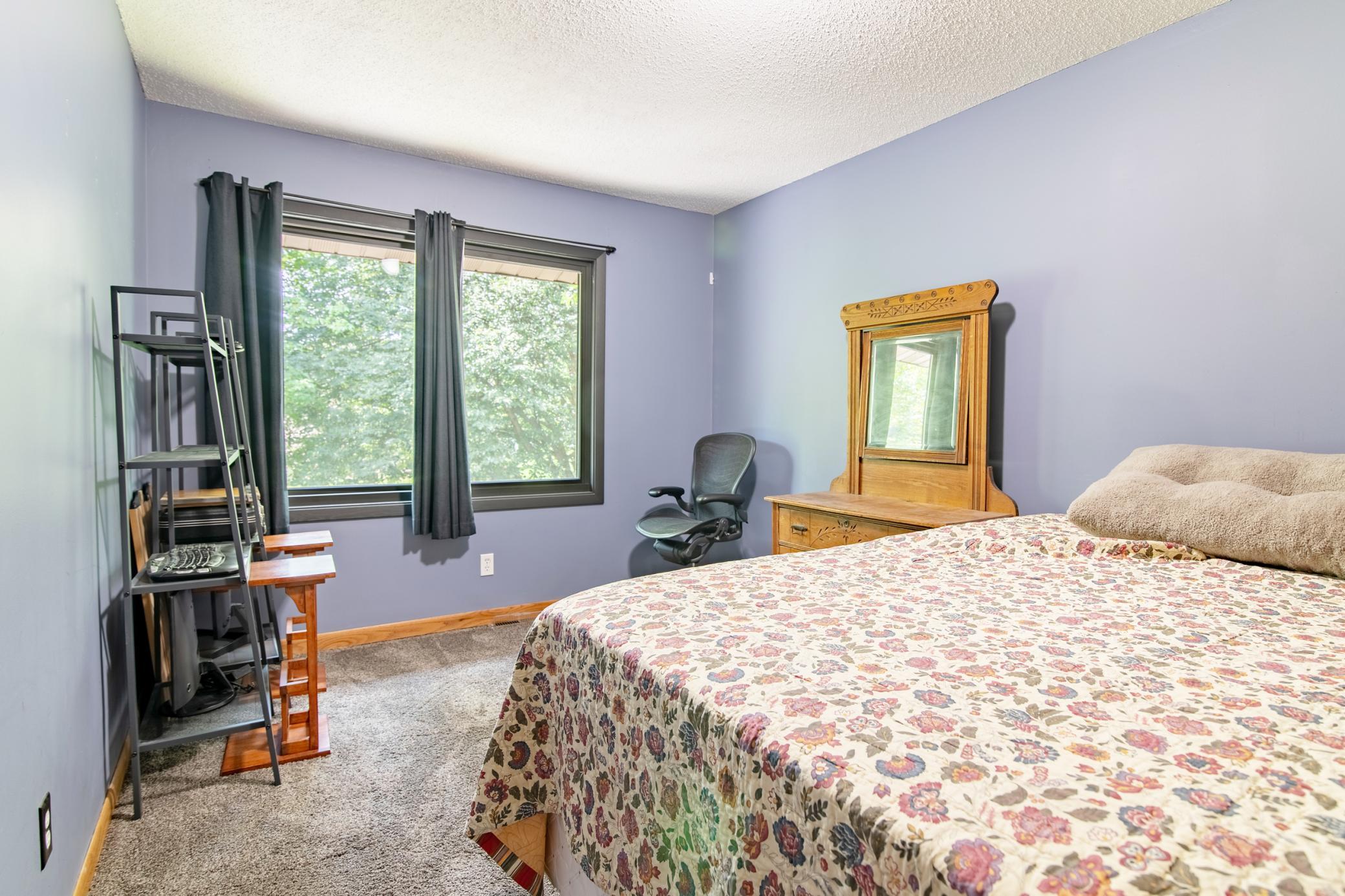 One of two main level bedrooms, this room features windows that face South/Southeast