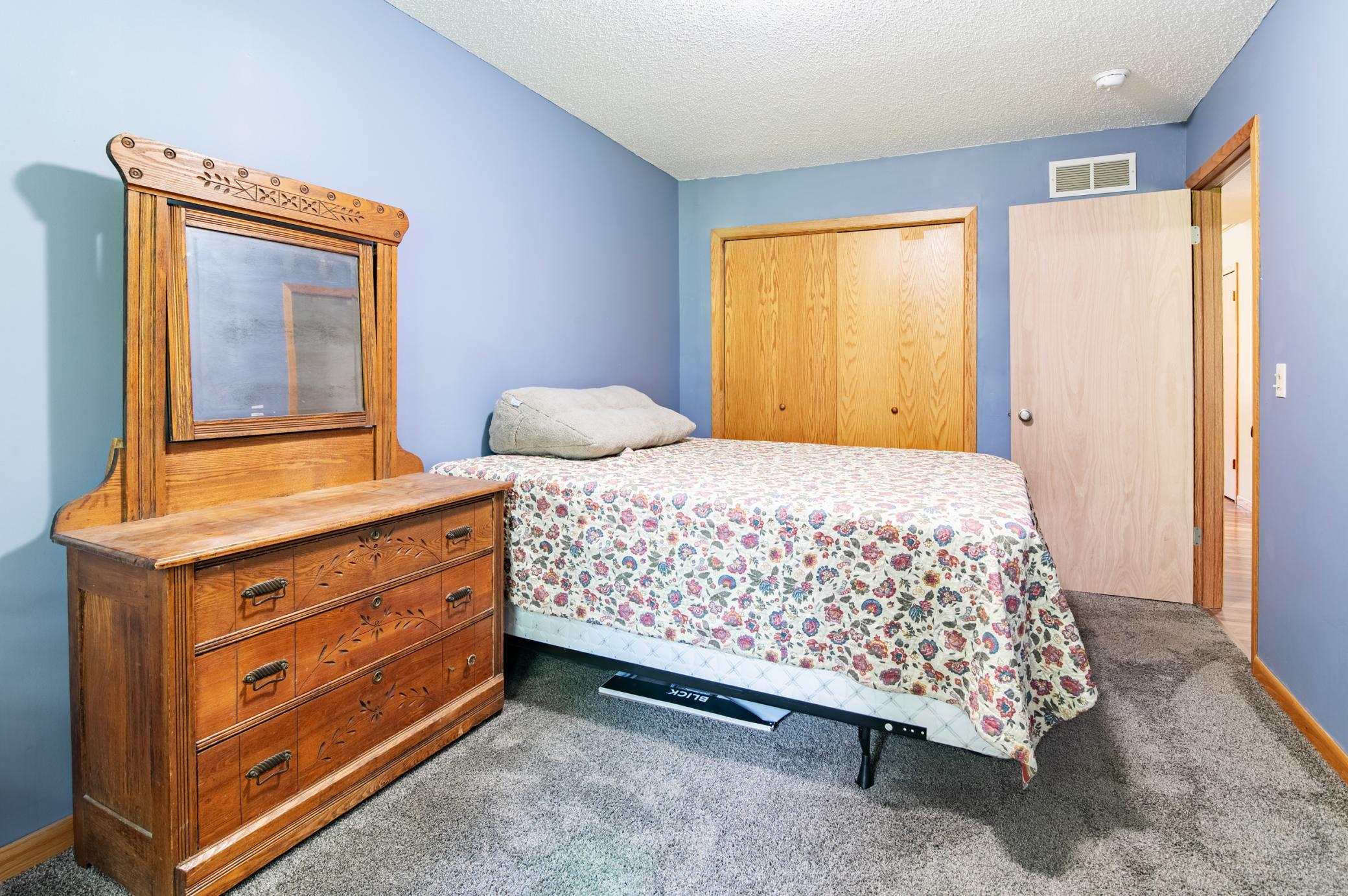 This bedroom measures approximately 9'6" by 15' and features a sizeable closet.