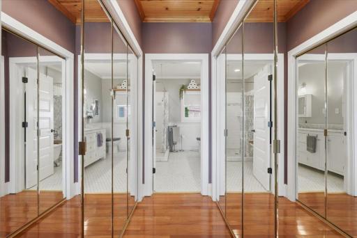 Large closet with ample storage, offering privacy between the bedroom and ensuite bathroom