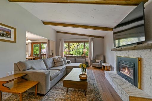 Large, light-filled living room flows seemlessly into the dining for ease.