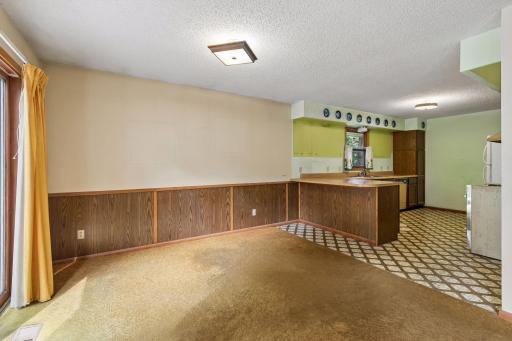 Dining room is open to the kitchen. Casual dining at the breakfast bar is another option
