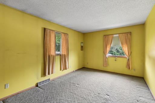 2nd of 2 main level bedrooms, features 2 windows and a double closet