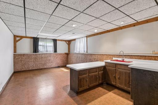 Amusement room in the lower level, could be turned into a 3rd bedroom if needed. 2 windows, wet bar, recessed lights and linoleum floors
