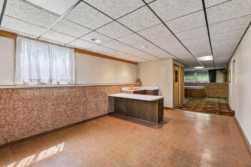 Amusement room faces the family room, lower level storage, mechanicals and bathroom is on the right