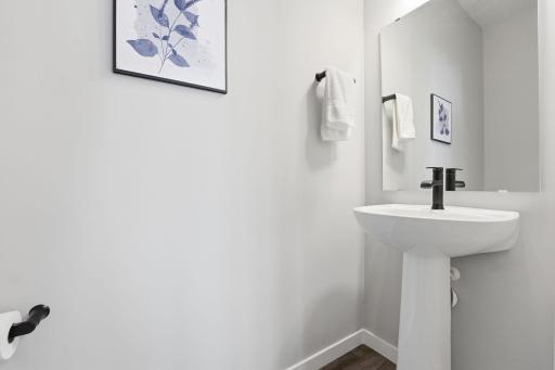 One of four bathrooms. The Powder Room is pefectly positioned near the garage/mudroom.