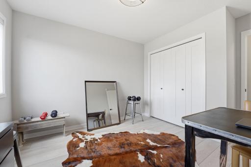 The second of three bedrooms on the upper level. Currently being used as a multi-functional space.