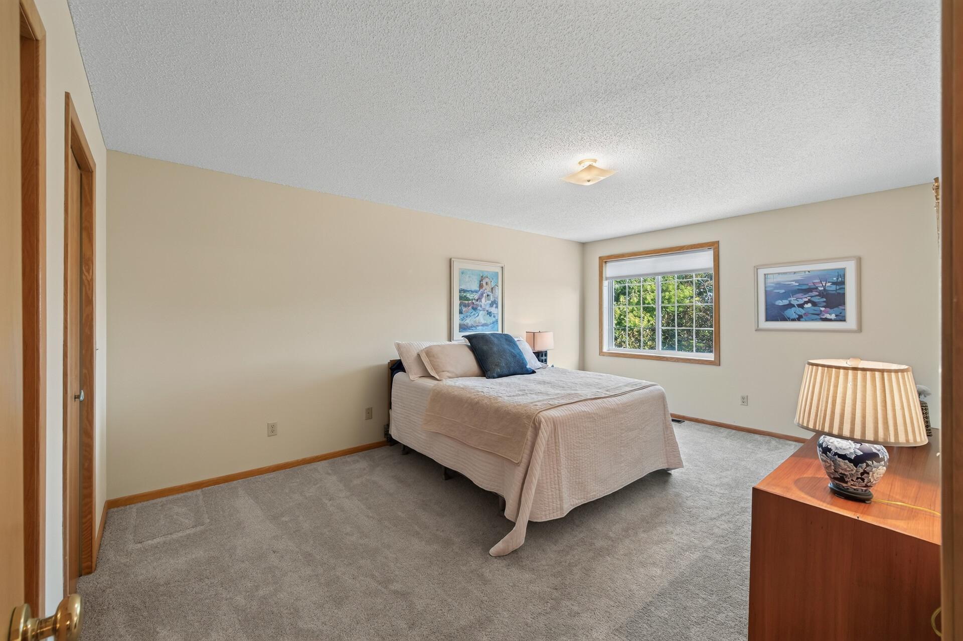 Retreat to the primary bedroom to relax
