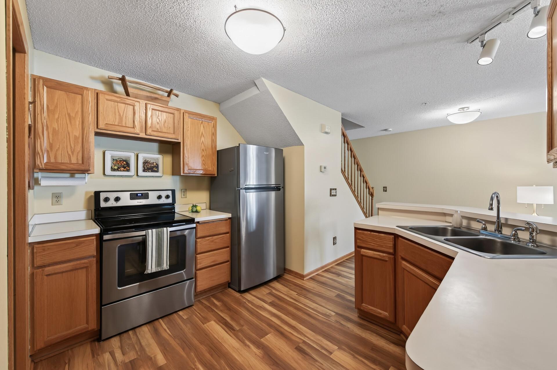 Cute functional kitchen with stainless appliances