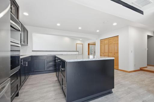 Behind the six panel doors is a spacious pantry area.