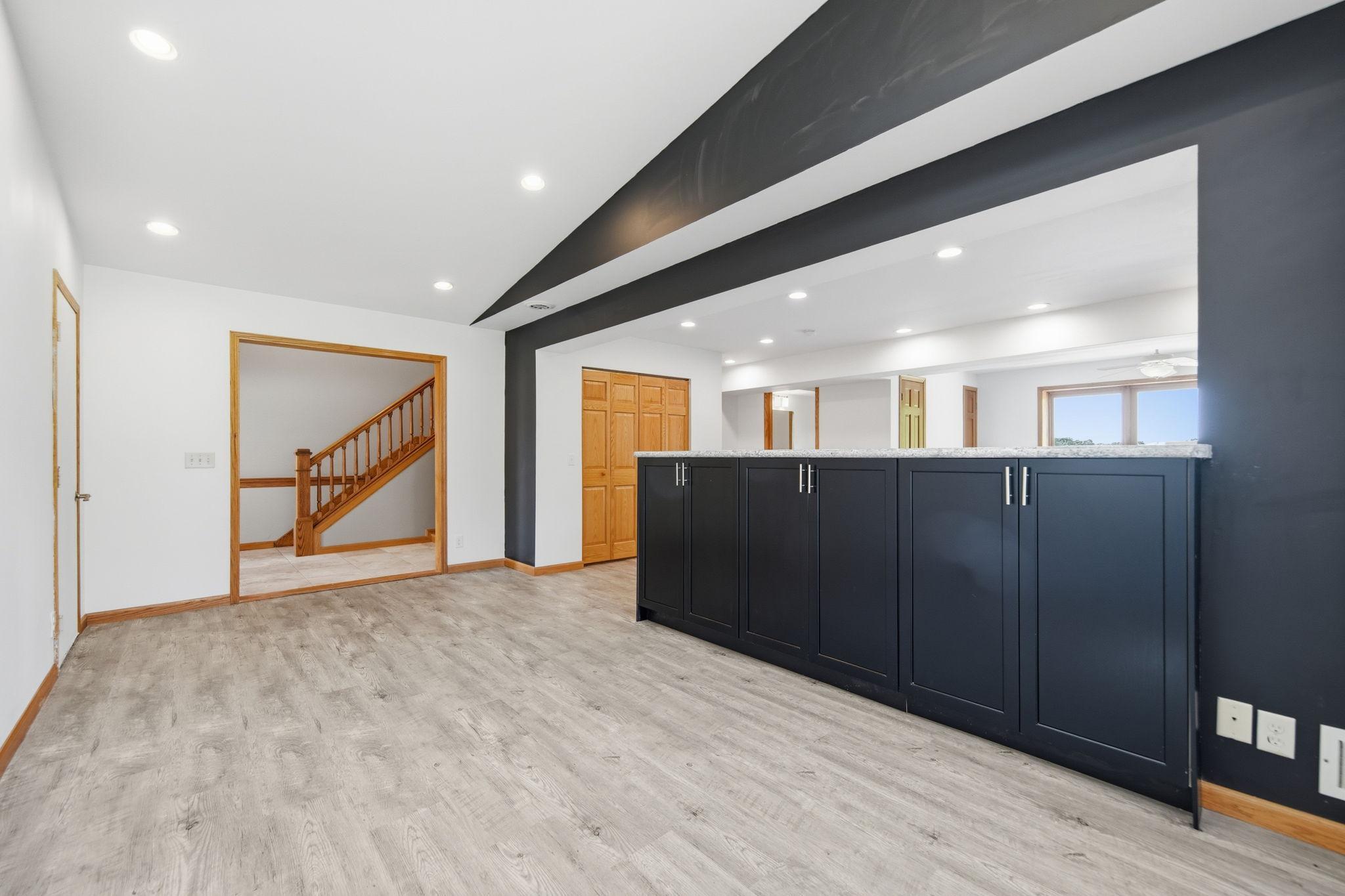 The door on the left in this photo leads to the garage entry.