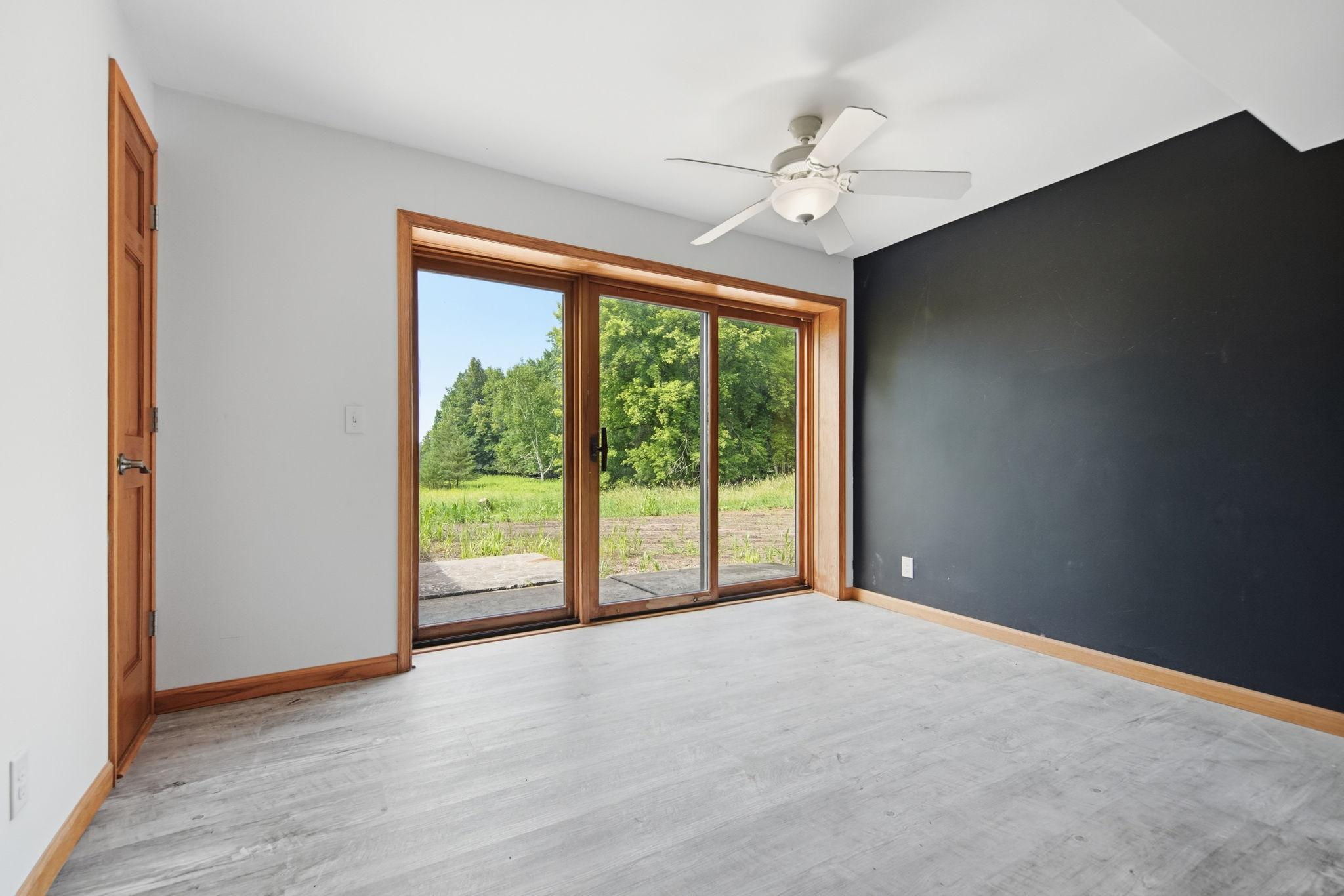 This area can easily flex with the space on the other end of this large room. Place a dining table here and family room furniture on the other end. Or, make this the family room area with nice lighting and views to the outdoors.