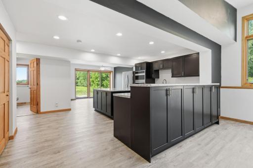 The tall cabinet room divider features spacious storage options.