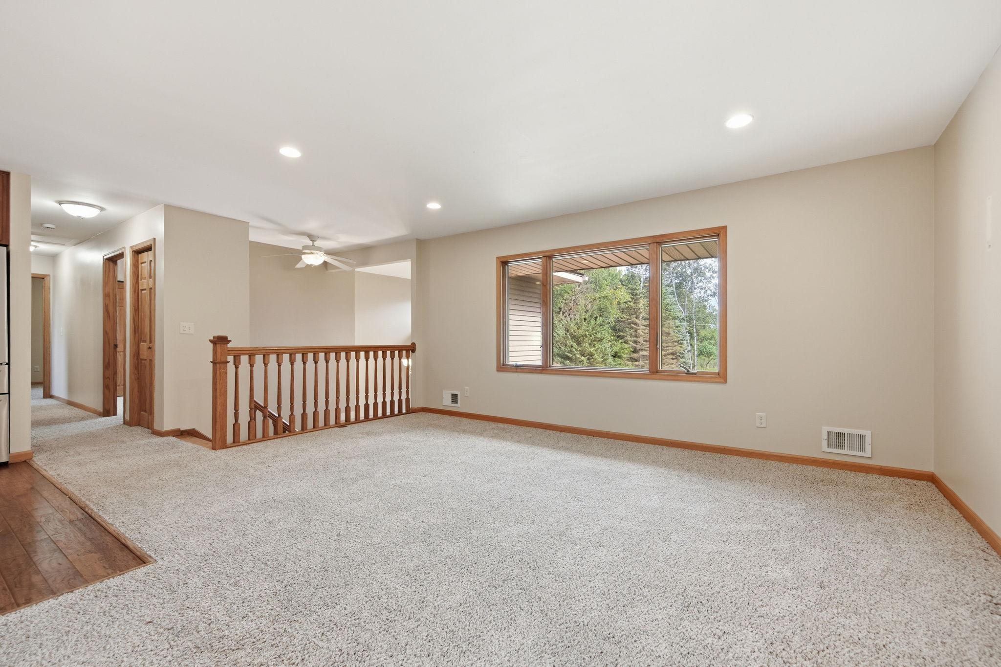 The upper-level of this home features a nice, open living room/ kitchen/dining room floor plan.