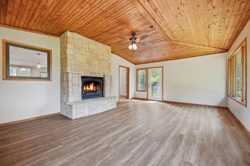 You'll love the easy care floors and the knotty pine ceiling. The clearview glass door leads to the deck area.