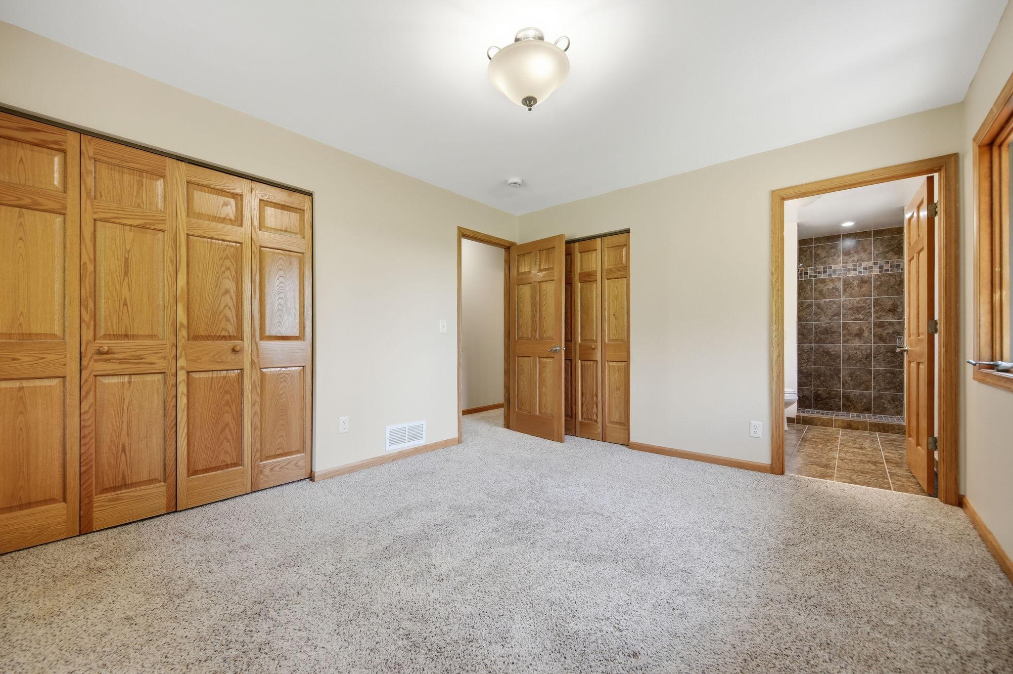 The owner's suite is located at the end of the hallway. You'll appreciate two larger closets with nice closet organizer systems and a private bath.