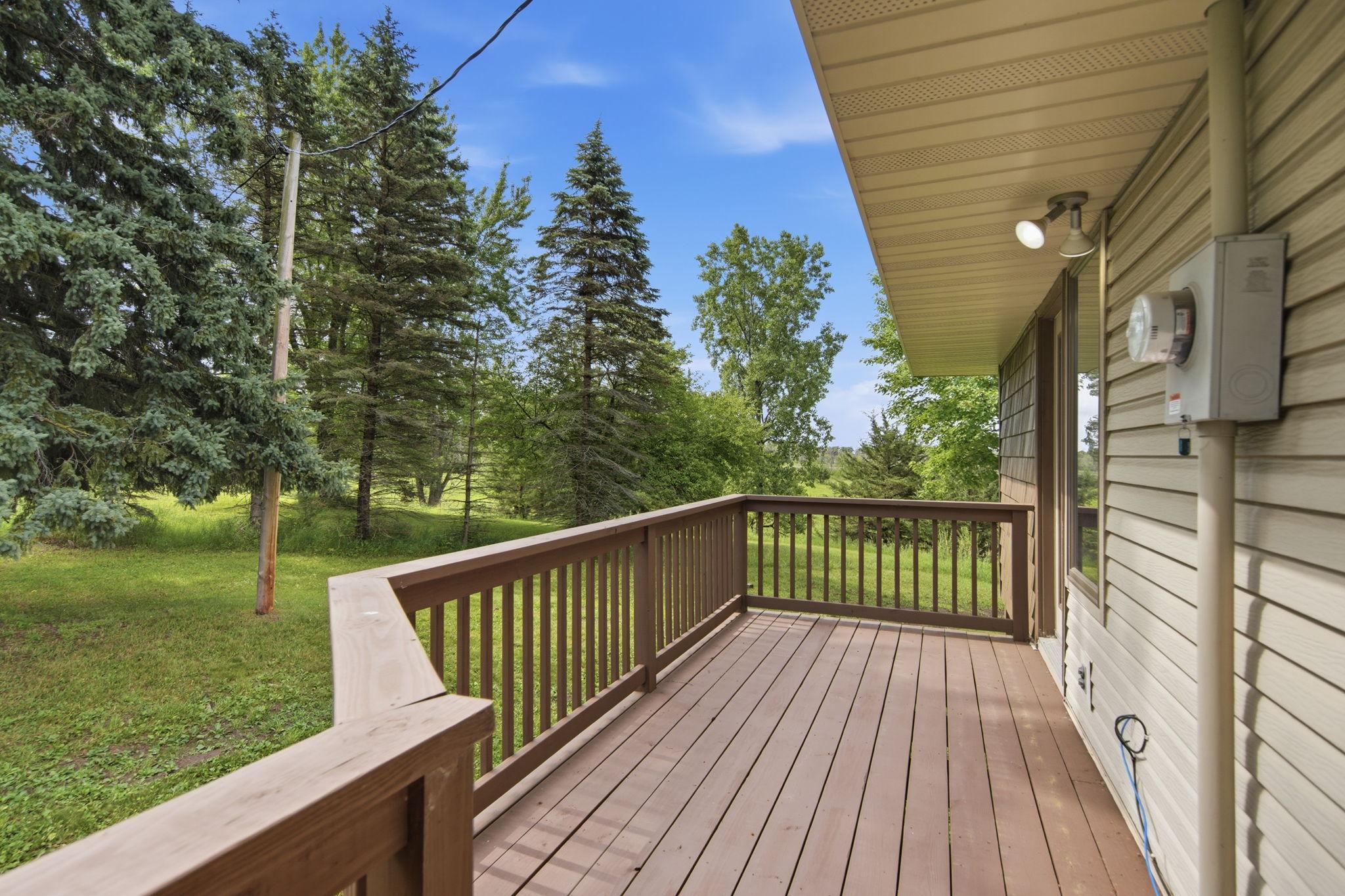 The new deck is large enough for a small table and chairs along with a grill.