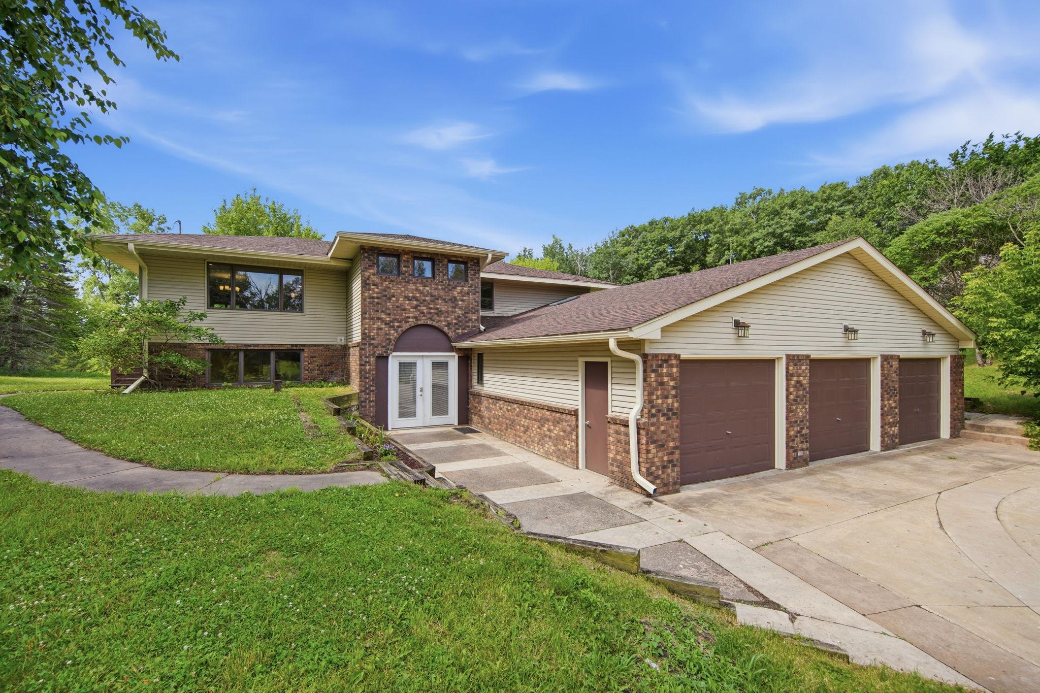 The three car garage features three separate garage doors, a spacious interior large enough to hold just about any size vehicle, and a side service door.