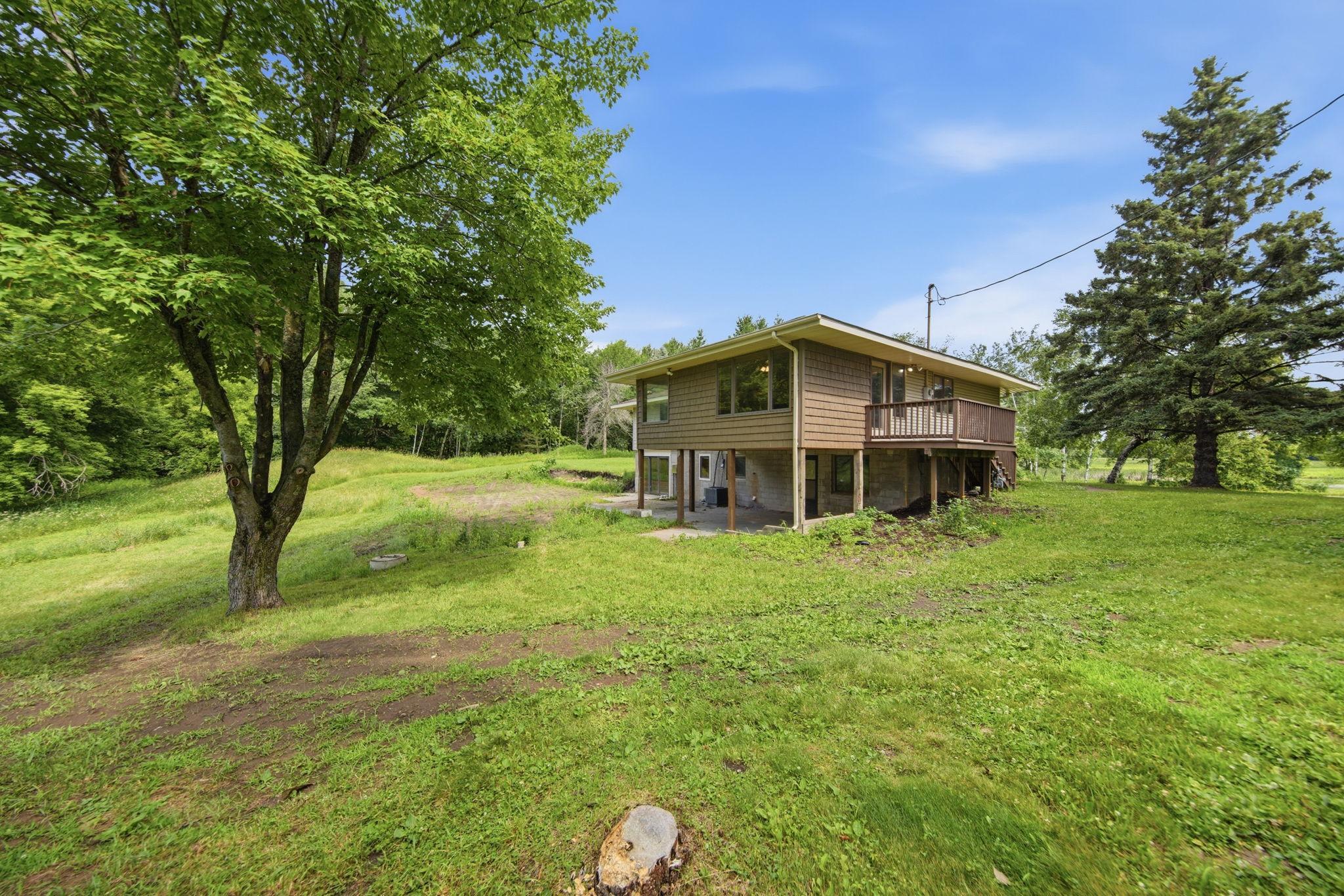 In this corner view of the home, you can see the new maintenance free shakes on the porch and the new deck.