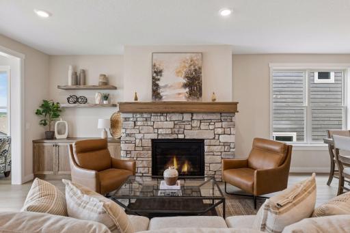 Beautiful stone gas fireplace with custom built-in cabinet