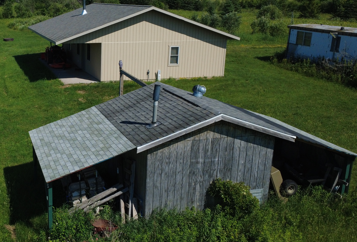 West side of Cabin and Storage Buildings