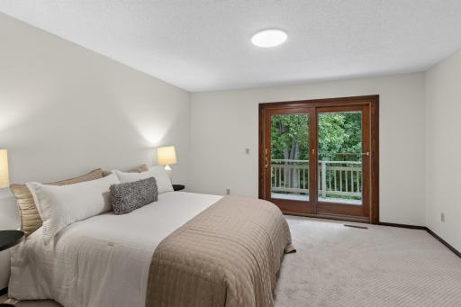 Main level: primary bedroom with 3/4 bathroom ensuite and deck